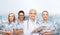 Smiling female doctor and nurses with stethoscope