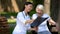 Smiling female doctor showing spinal x-ray to happy elderly woman in wheelchair