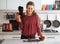 Smiling female food photographer in kitchen