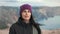 Smiling female hiker walking on top high mountain enjoying trekking travel trip medium closeup