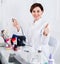 Smiling female manicurist showing her workplace