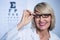 Smiling female optometrist wearing spectacles