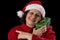 Smiling Female Senior with Red Santa Claus Cap