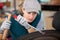 Smiling female technician working on car tyre