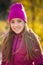 Smiling female teen in sportswear walking in autumnal morning li