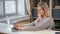 Smiling female working chatting surfing internet on laptop sitting desk in comfortable home office