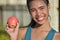 Smiling Filipina Female With Apple