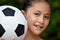 Smiling Filipina Teen Athlete Female Soccer Player With Soccer Ball
