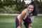 Smiling fitness woman resting after running