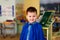 Smiling five-year-old child on a blurred kindergarten background