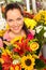 Smiling florist woman colorful bouquet flower market