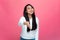 Smiling friendly asian young girl extending hand at camera, offer handshake, welcome, greeting. Deal proposal