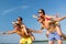 Smiling friends having fun on summer beach