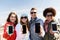 Smiling friends showing blank smartphone screens