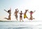 Smiling friends in sunglasses on summer beach