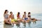 Smiling friends in sunglasses on summer beach