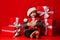 Smiling funny child in Santa red hat holding Christmas gift in hand. Christmas concept.