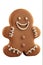 Smiling gingerbread man cookie cut out and isolated on a white background