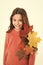 Smiling girl in autumn sweater. weather forecast. fallen leaves in autumn nature beauty. school season. warm clothes