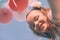 Smiling girl with colorful balloons - Low angle view - Retro look