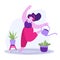 Smiling girl dances with headphones and watering flowerpots