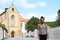 Smiling girl in front of Monastery Temple of the Assumption of the Virgin Mary