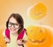 Smiling girl in glasses over pumpkins background