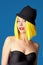 Smiling girl in hat.Yellow Hair