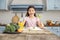 Smiling girl and having healthy breakfast