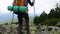 Smiling girl hiker on mountain summit