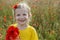 Smiling girl holding bouquet poppies