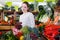 Smiling girl in interior of greengrocery