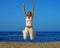 Smiling girl jump at the beach