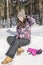 Smiling girl modeling in the snow