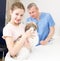 Smiling girl with puppy visiting veterinarian clinic