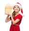 Smiling girl in santa helper hat with gift box