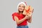 Smiling girl in snata hat with christmas gift