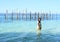 Smiling girl soaking wet in sea