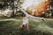 Smiling Girl in Sportswear Doing Yoga in Park.