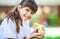 Smiling girl with a spring duckling