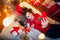 Smiling girl taking a selfie with smarphone and lying on floor. Christmas mood