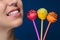 Smiling girl with three cakepops