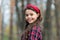 Smiling girl wear knotted headband. Biggest Hair Accessory Trends. Adorable little girl checkered shirt wear red