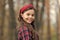 Smiling girl wear knotted headband. Biggest Hair Accessory Trends. Adorable little girl checkered shirt wear red