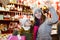 Smiling girl with woman are buying toys for X-mas tree