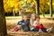 Smiling girls in the autumn park