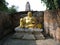 Smiling golden Buddha in one of the temples in Ayutthaya, former capital of the kingdom of Siam. Thailand