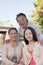 Smiling Granddaughter with grandparents, portrait