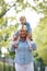 Smiling grandmother piggyback ride with baby