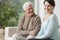 Smiling grandpa and caring granddaughter